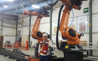 Synergy in action: SprutCAM X synchronizes two KUKA robots on one rail | SprutCAM X